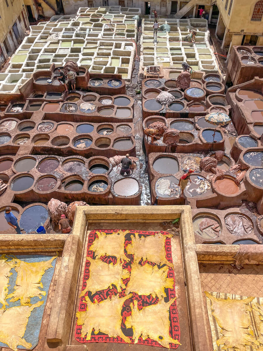 A birds eye view of the infamous leather tannery in Fes Medina - a must see on a road trip of Morocco