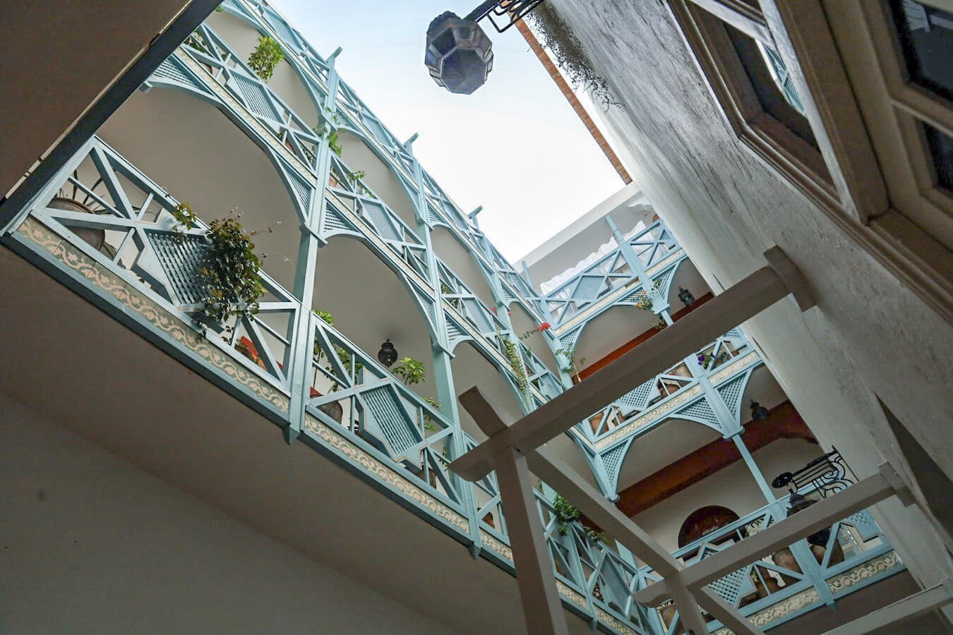 Looking up at the blue terraces of Ryad Watier from the courtyard.