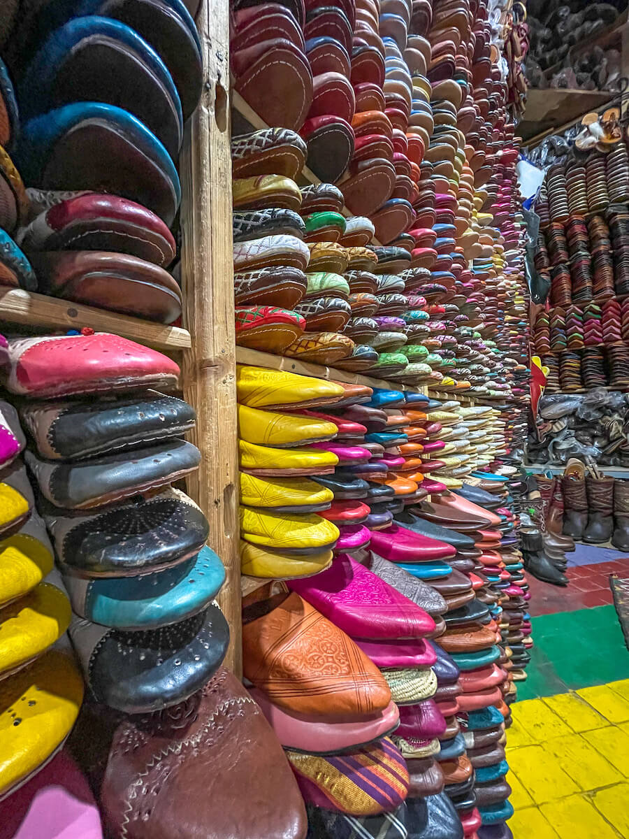 Leather Moroccan slippers line the shelves in the Chouara Tannery in Fes