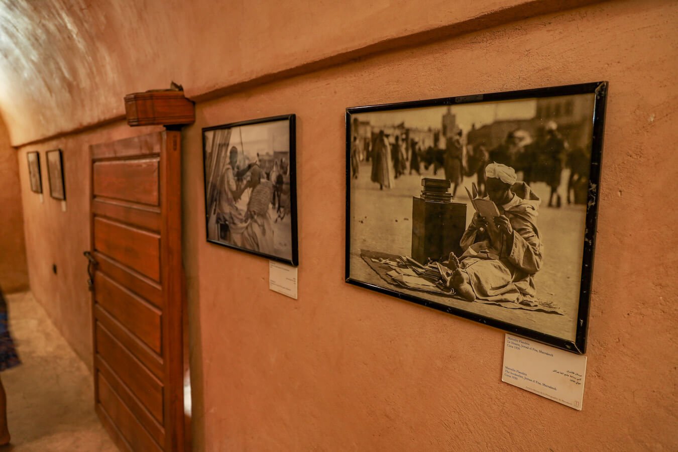 A photo of an antique photo - a bookseller in Marrakech Djemaa el-Fna, Morocco - in the small exhibition in the El Badi Palace