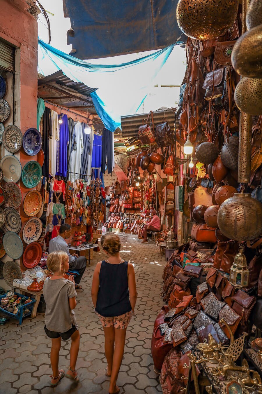 Two girls walk through the Marrakech Medina - visiting 3 days in Marrakech