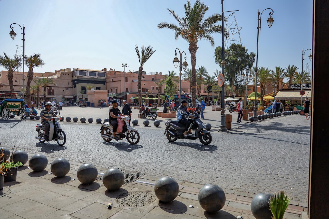 Scooters drive through the street in Morocco
