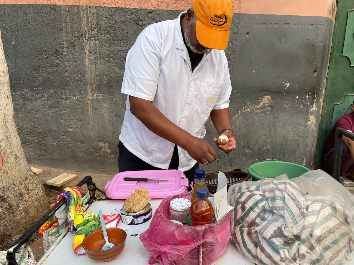 A man prepares street food in Morocco