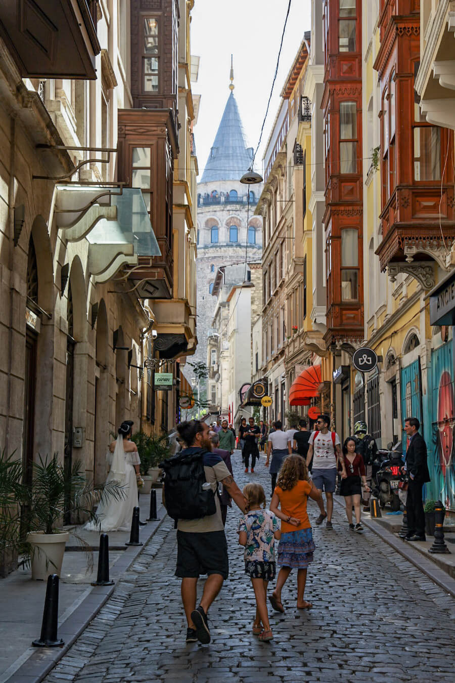Family walk the vintage shopping district in the Serdar-ı Ekrem street of Istanbul.