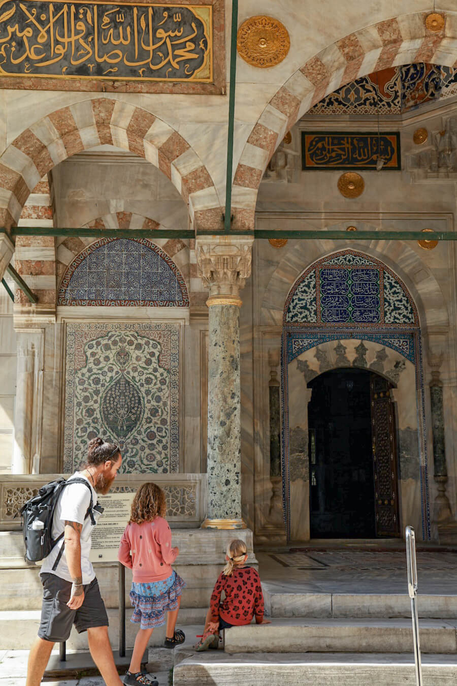 Father and children visit the Sultan's tombs at the Hagia Sophia. 
