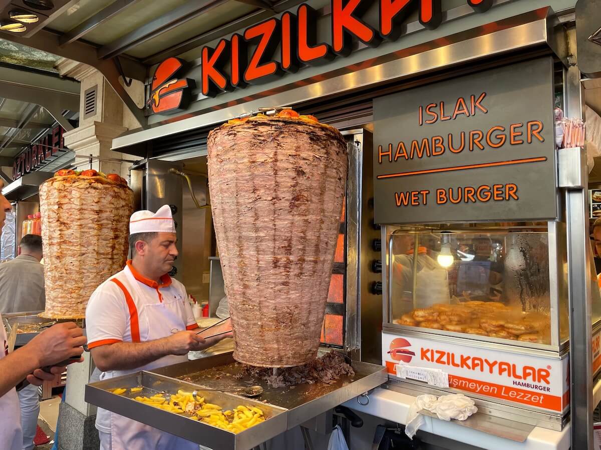 Men preparing Turkish kebab street food in Taksim Square Istanbul