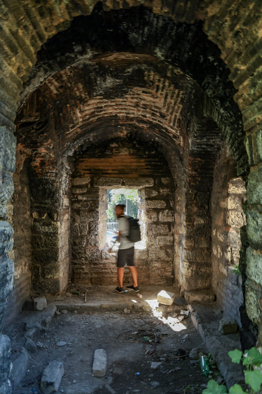 Man looks out a lookout window from the wall of Constantinople - a walking tour is a unique thing to do in Istanbul