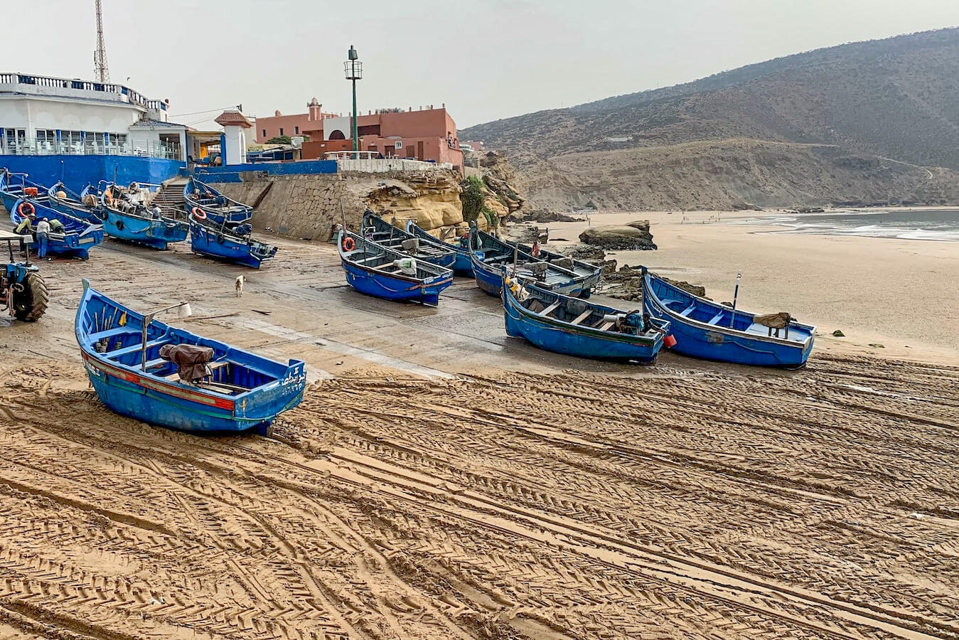 Imsouane beach - fishing boats line the beach at the busy port