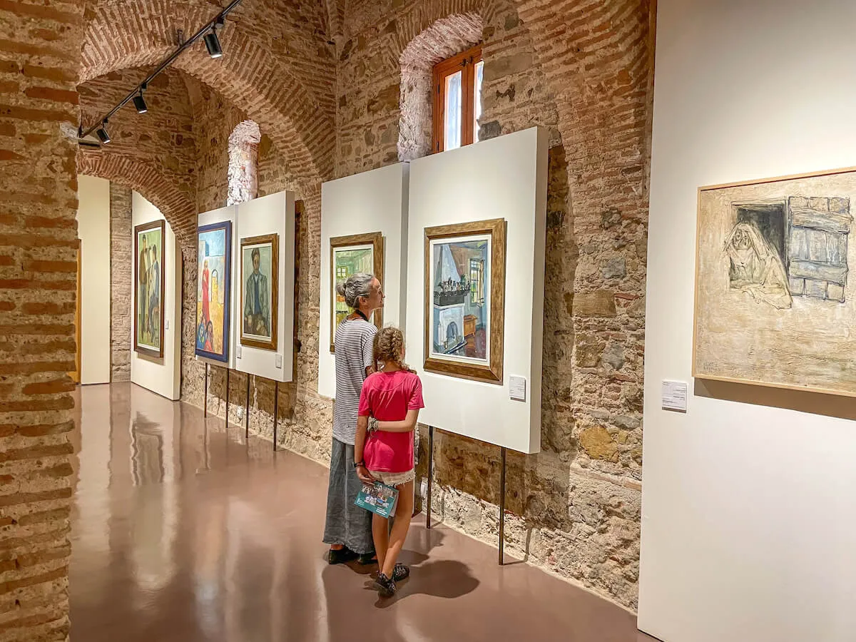 A mother and daughter enjoy the gallery inside the Museum of Modern Art in Tangier, a good location to visit on a day trip from Tarifa, Spain.