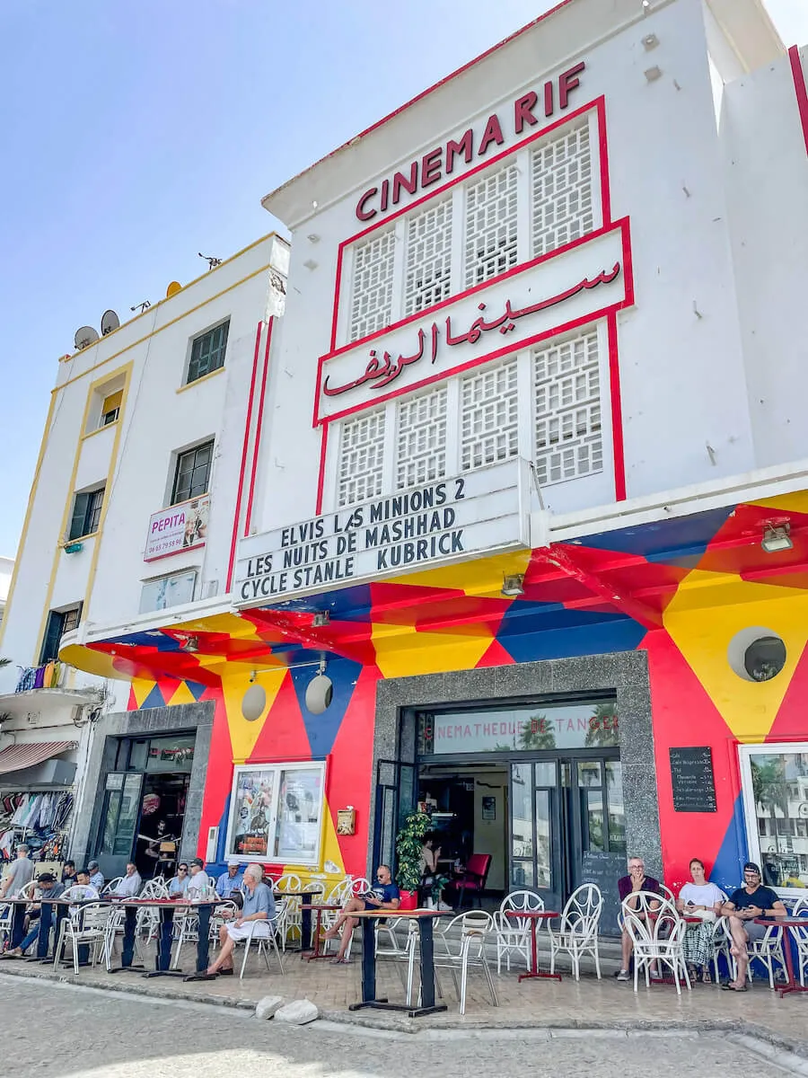 The iconic Cinema Rif near the Grand Socco in Tangier is a must see on a 1 day itinerary, as tourists gather for a drink outside.