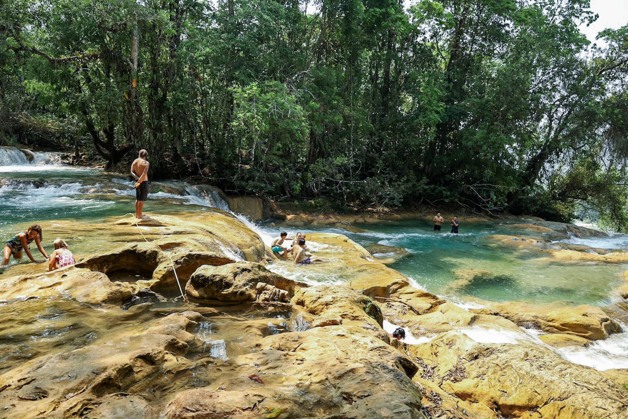Visitors swim in the pools above the waterfalls at Agua Azul, Mexico.