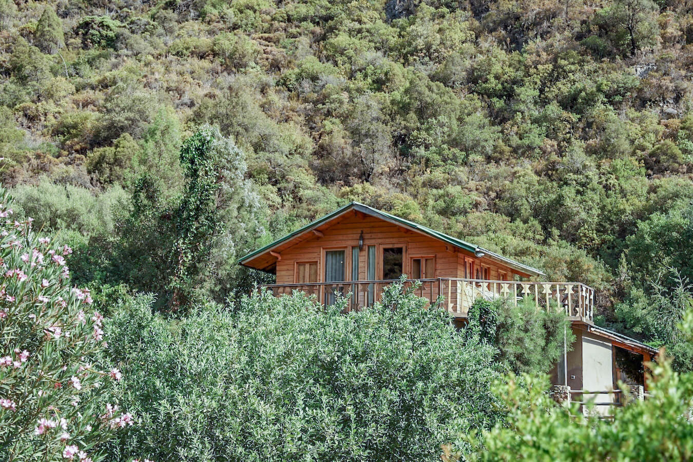 The Ermitage d'Akchour hotel peeks through the forest