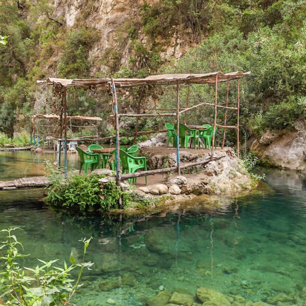 The unique river tables in Akchour on the God's Bridge trail - a day trip from Chefchaouen.
