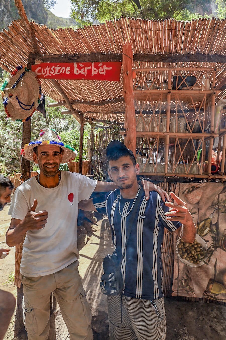 Hicham and Moroccan kitchen owner stand in front of their river restaurant - Cuisine Berber in the Akchour valley on the way to God's Bridge
