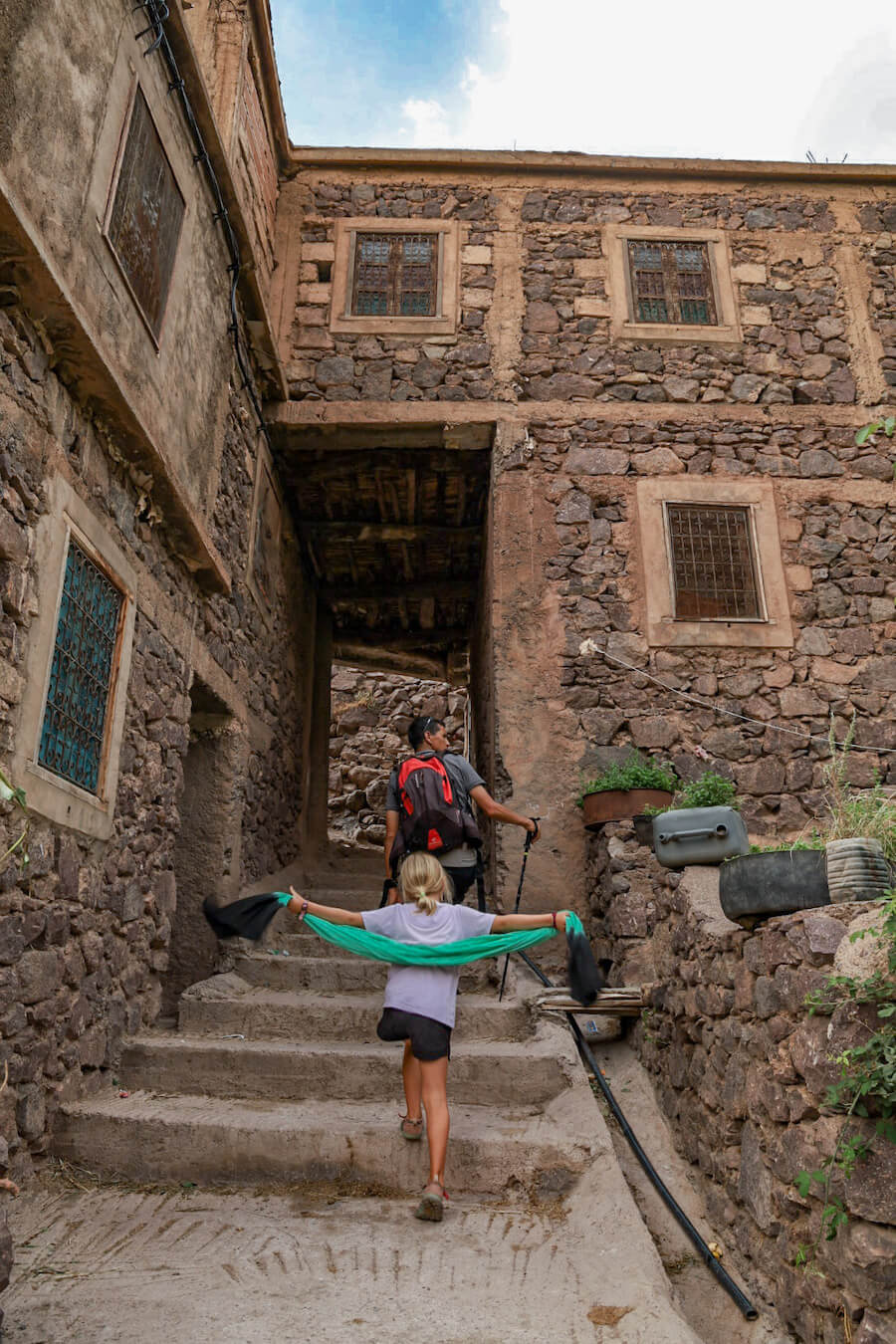 Walking through the village of Aroumd in the Atlas Mountain range in Morocco on a family tour