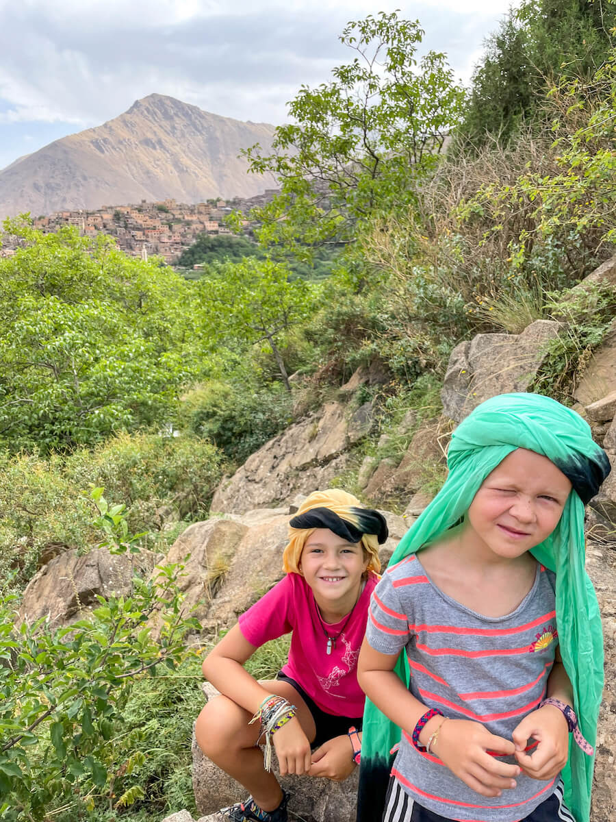 Kids in berber headdress on their hike of the Atlas Mountains in Morocco