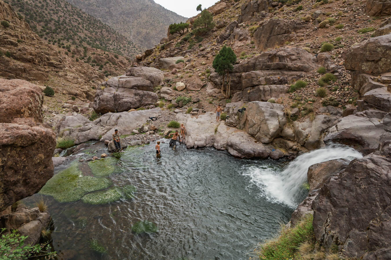 Swimming in summer in the fresh springs and waterholes of the Atlas Mountain range - cooling off after a trekking tour