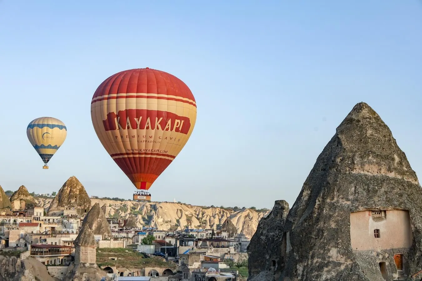 A fairy chimney cave hotel in Cappadocia with the best hot air balloon view.