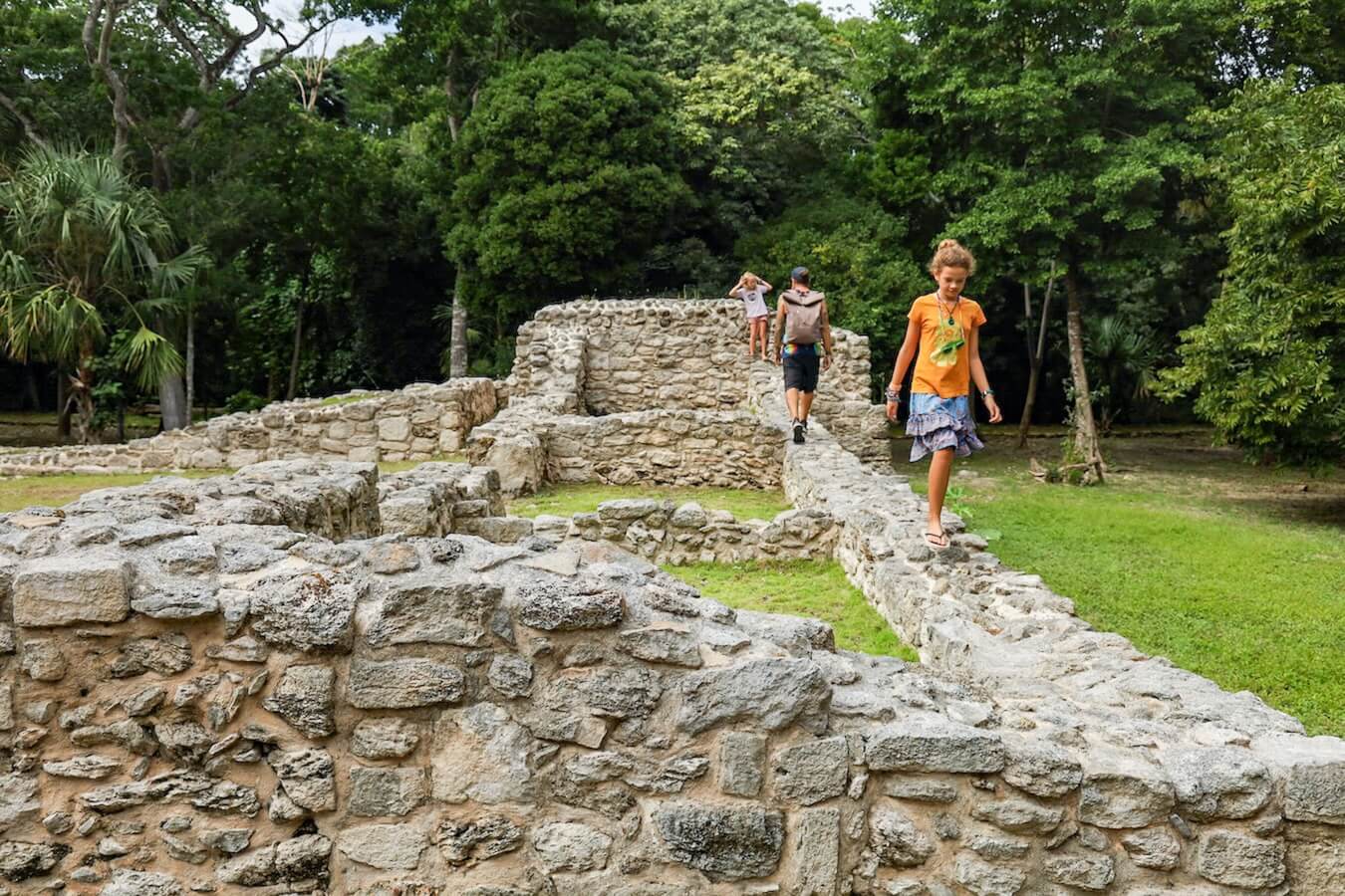 A family walks the Oxtankah Ruins near Chetumal on a day trip from Bacalar