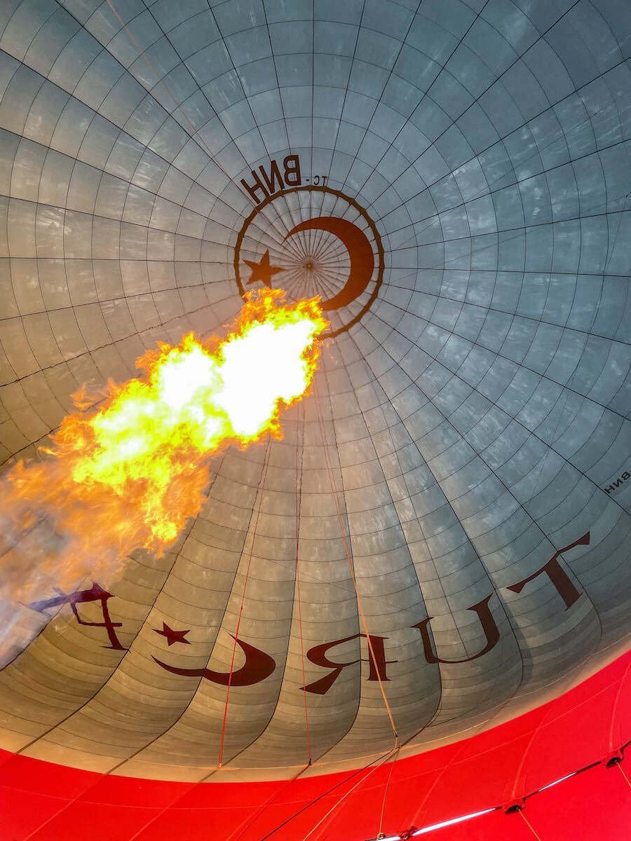 Looking up inside the hot air balloon on the Turca balloon as the fire burns - many people wonder what to wear on a hot air balloon and the fire can make it very warm
