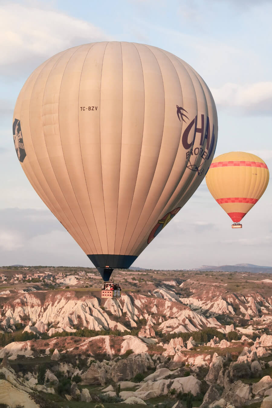 Two hot air balloons fly over unique landscape of rock valleys in Cappadocia - review on whether it is worth they hype.