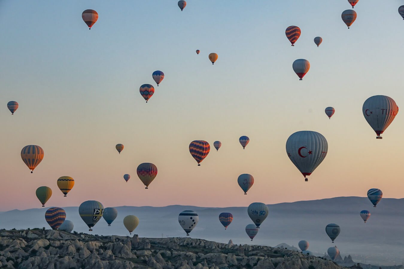 Hot air balloons fill the sky over Goreme in Cappadocia at sunrise - a magical sight but is it worth the money?