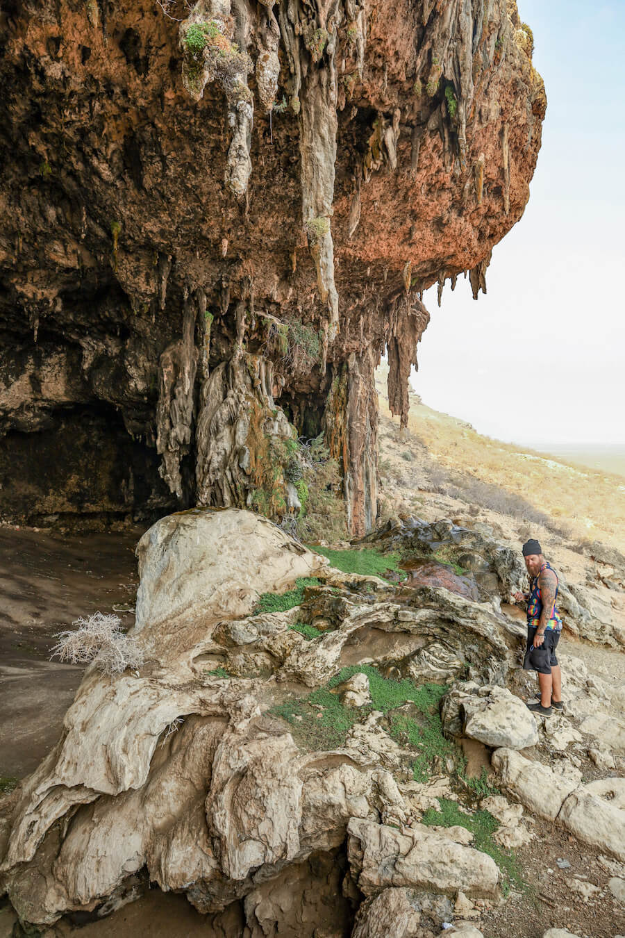 A man explores a cave in Socotra
