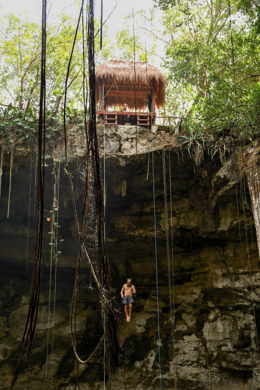 A man jumps into Secreto Maya Cenote near Valladolid, from the 22 meter jumping platform.