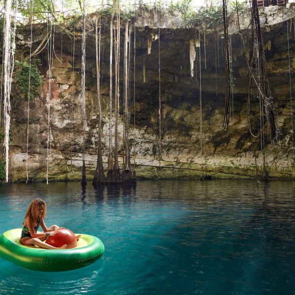 A child floats on an avocado inflatable at Cenote Secreto Maya near Valladolid in Mexico.