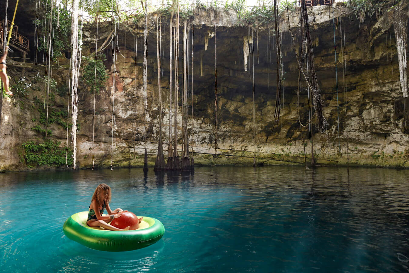 A child floats on an avocado inflatable at Cenote Secreto Maya near Valladolid in Mexico.