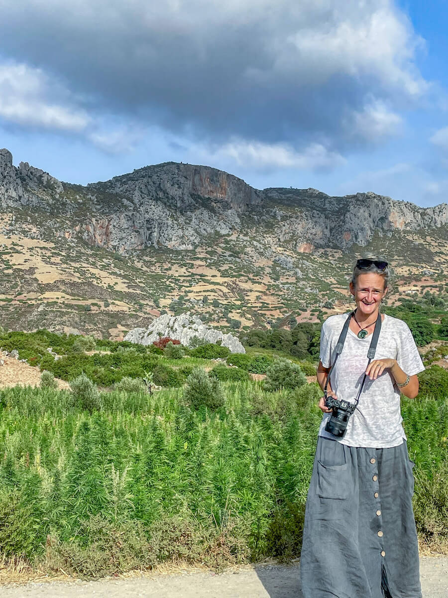 A woman photographs the fields of marijuana in Morocco in the Rif Valley