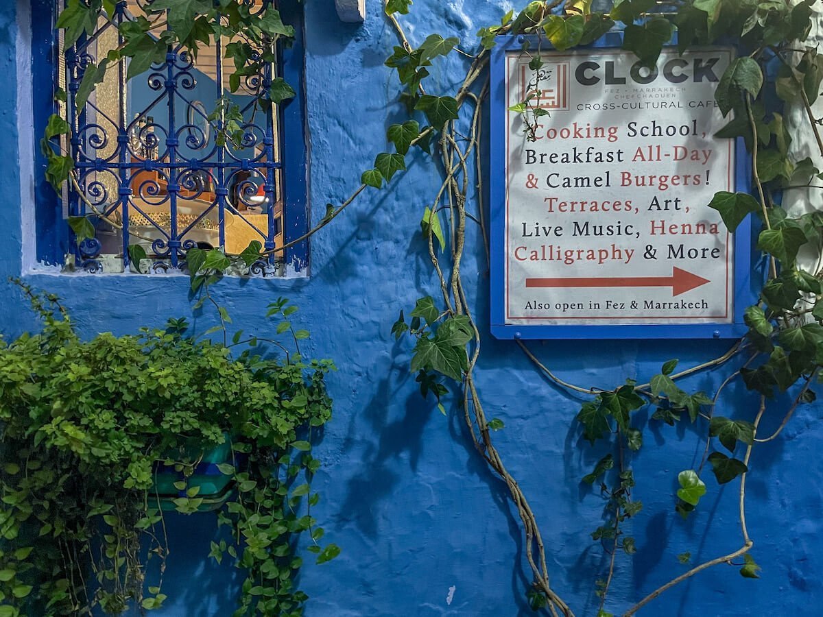 The blue entrance to the Clock Cafe in Chefchaouen - one of the best places to eat for a Chefchaouen itinerary