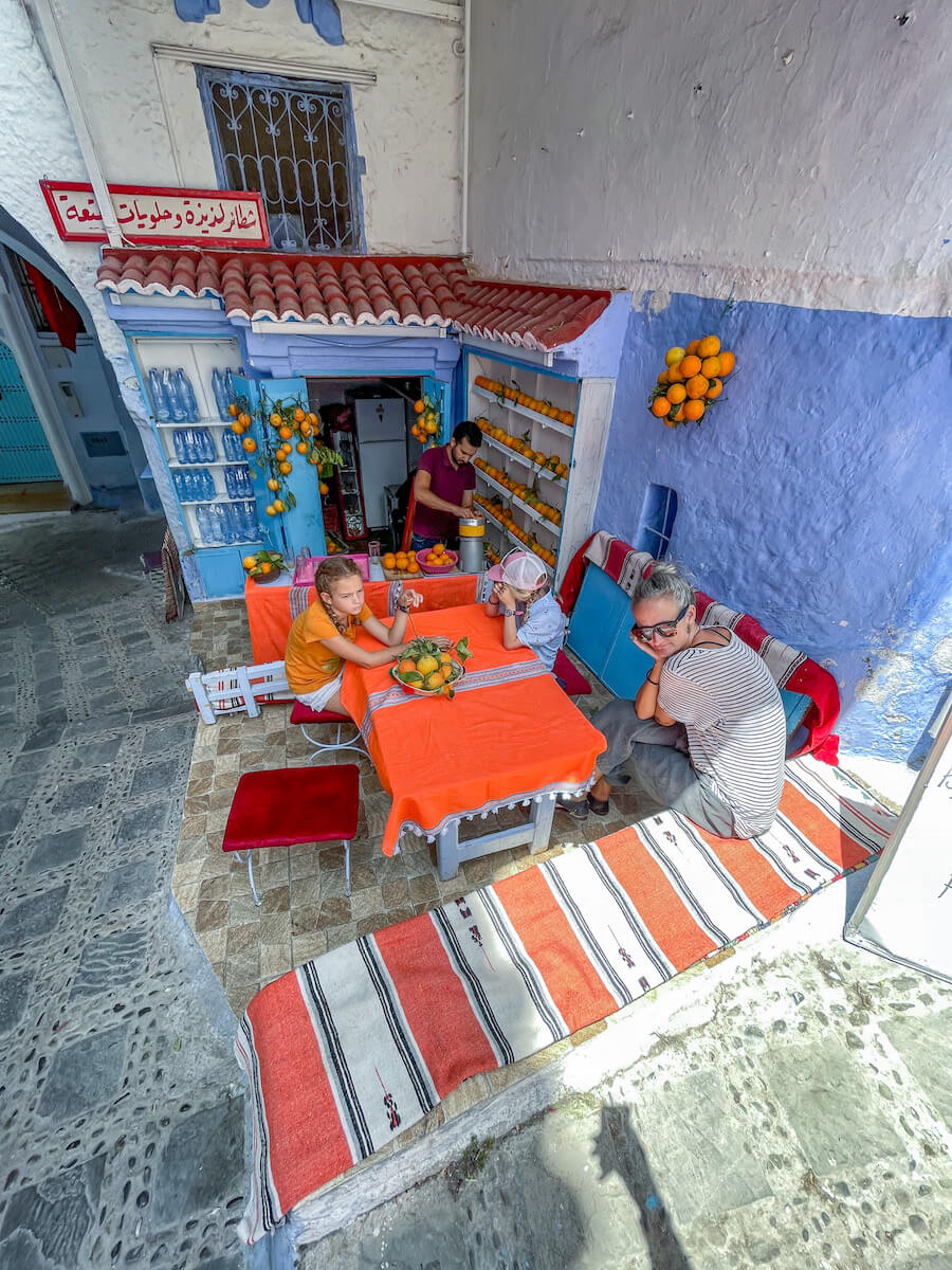 A family order an orange juice in Chefchaouen Morocco