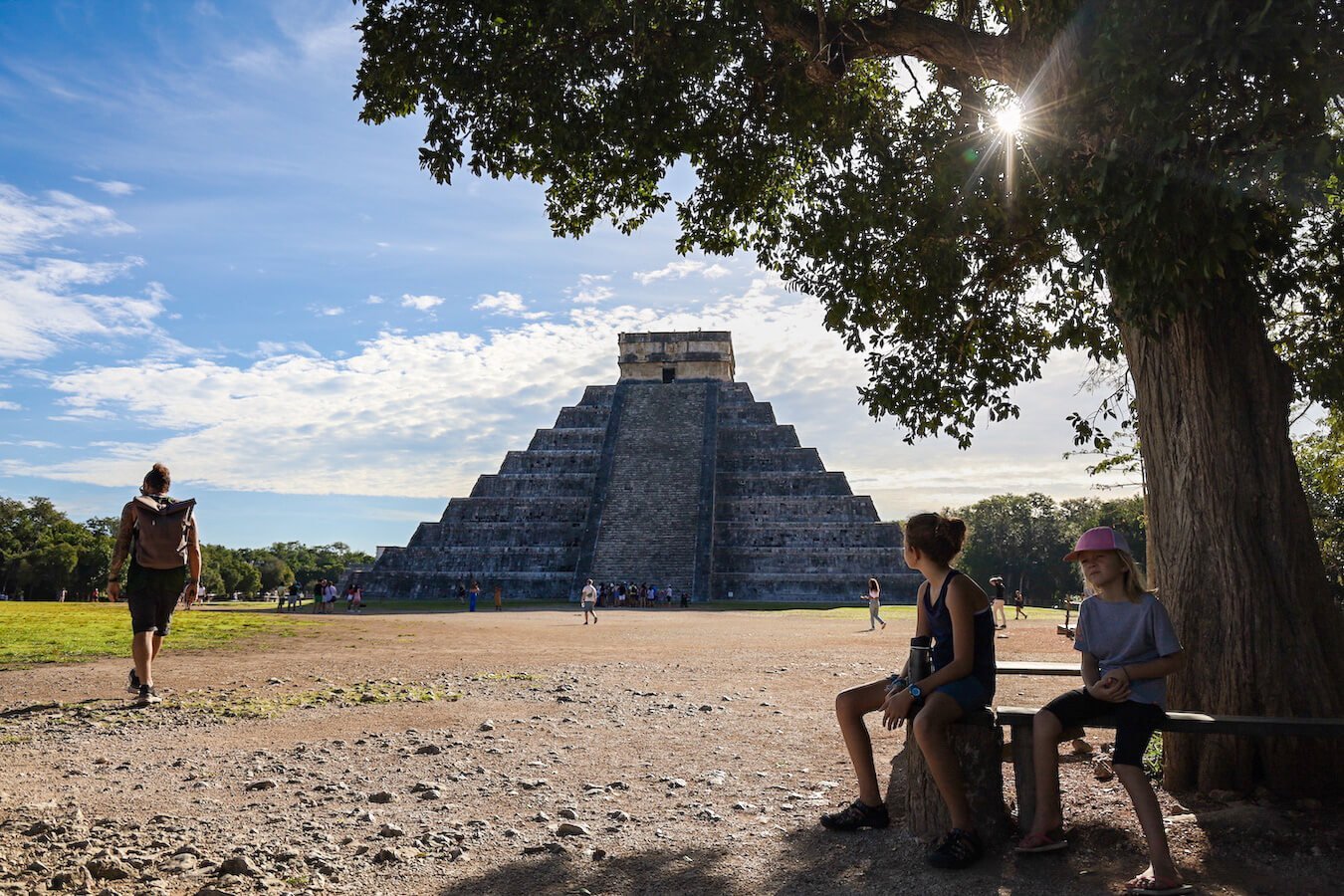 A man walks in front of the Kukulkan Temple early in the morning at Chichén Itzá without many tourists.  Our self-guided tour helps visitors understand this impressive structure without an organised group tour 