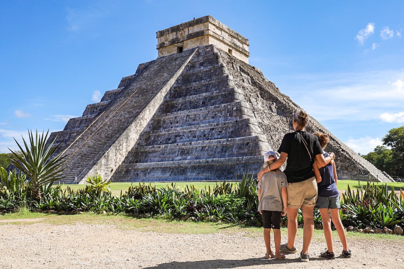 A mother and her daughters... in front of the Kukulkan Temple early in the morning at Chichén Itzá without many tourists.  Our self-guided tour helps visitors understand this impressive structure without an organised group tour 