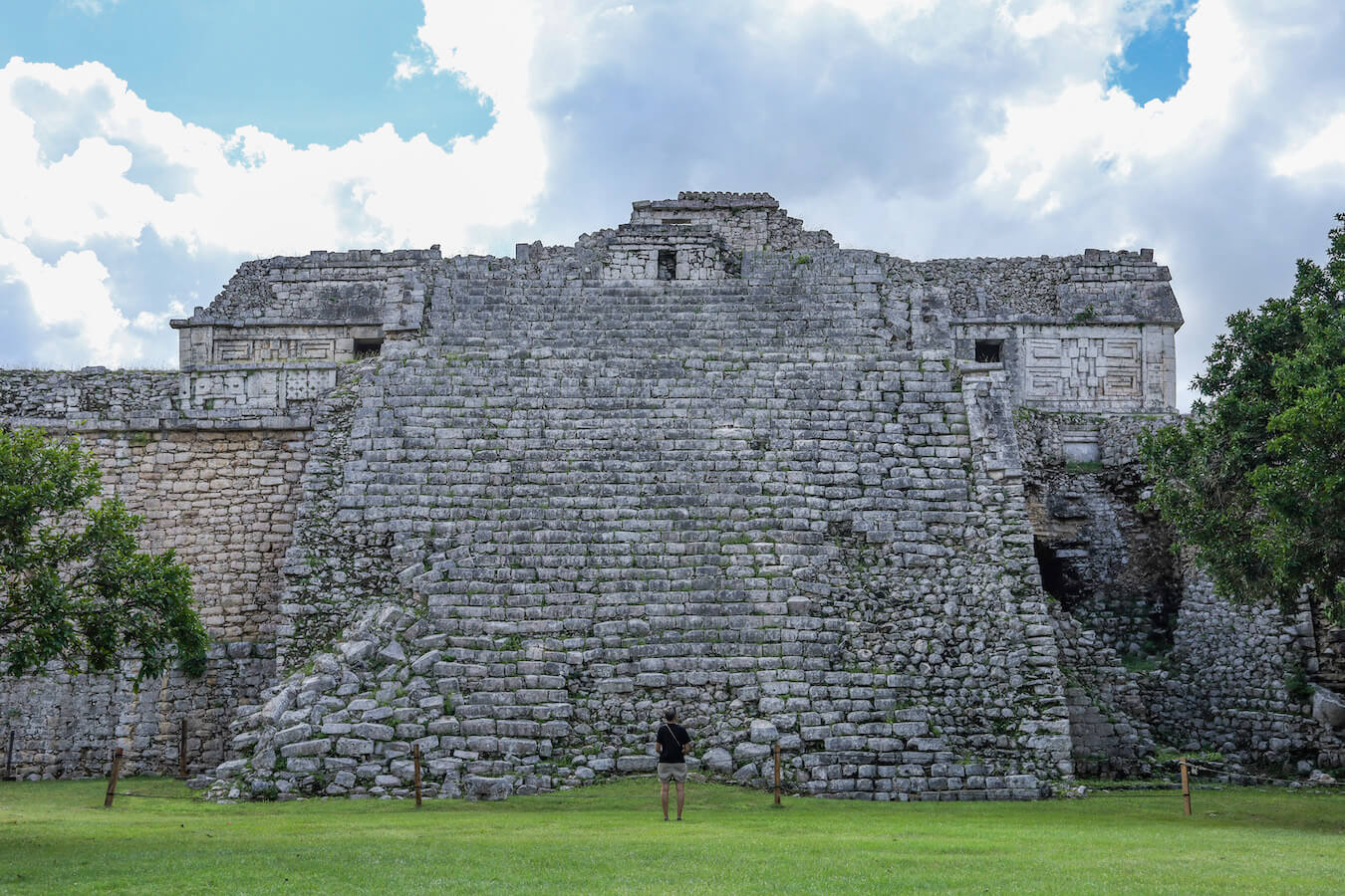 A visitor stands at the base of the Nunnery and Iglesia at Chichén Itzá - with a self-guided tour