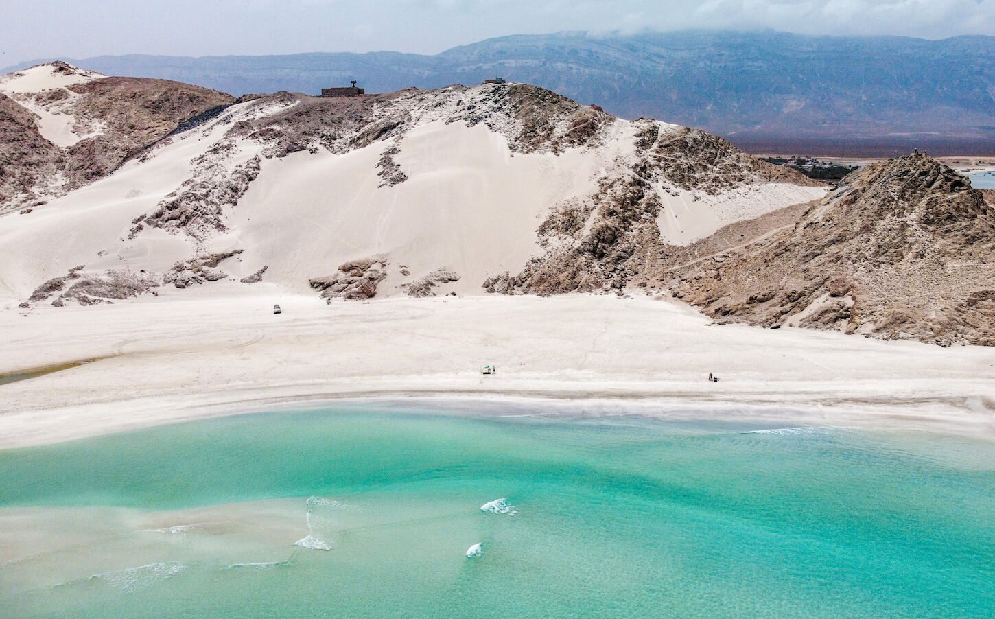 A birds eye view over beach and crystal blue water on Socotra - a must see place on an island tour