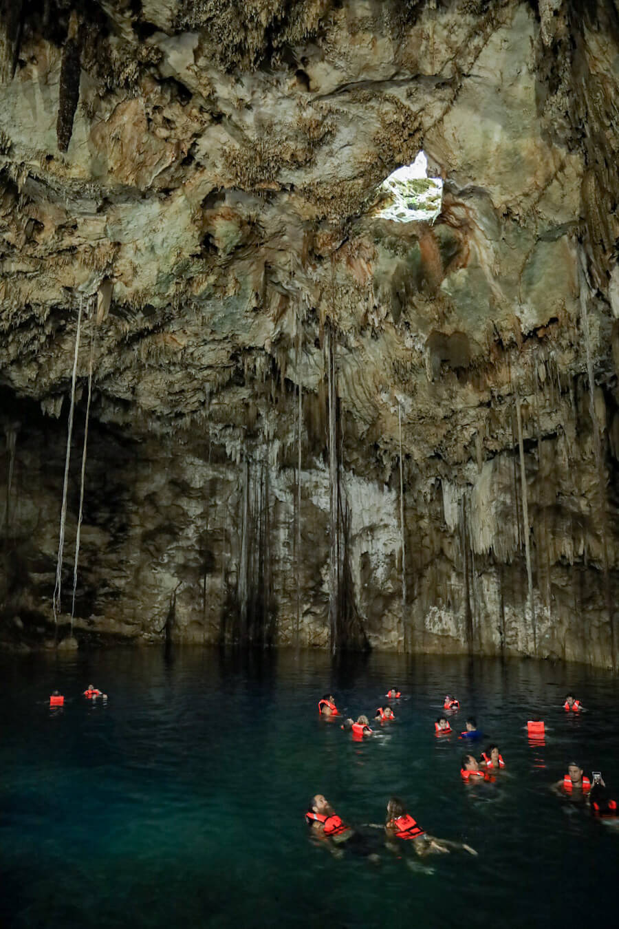 Tourists swim in the enclosed Xkeken Cenote in Dzitnup near Valladolid
