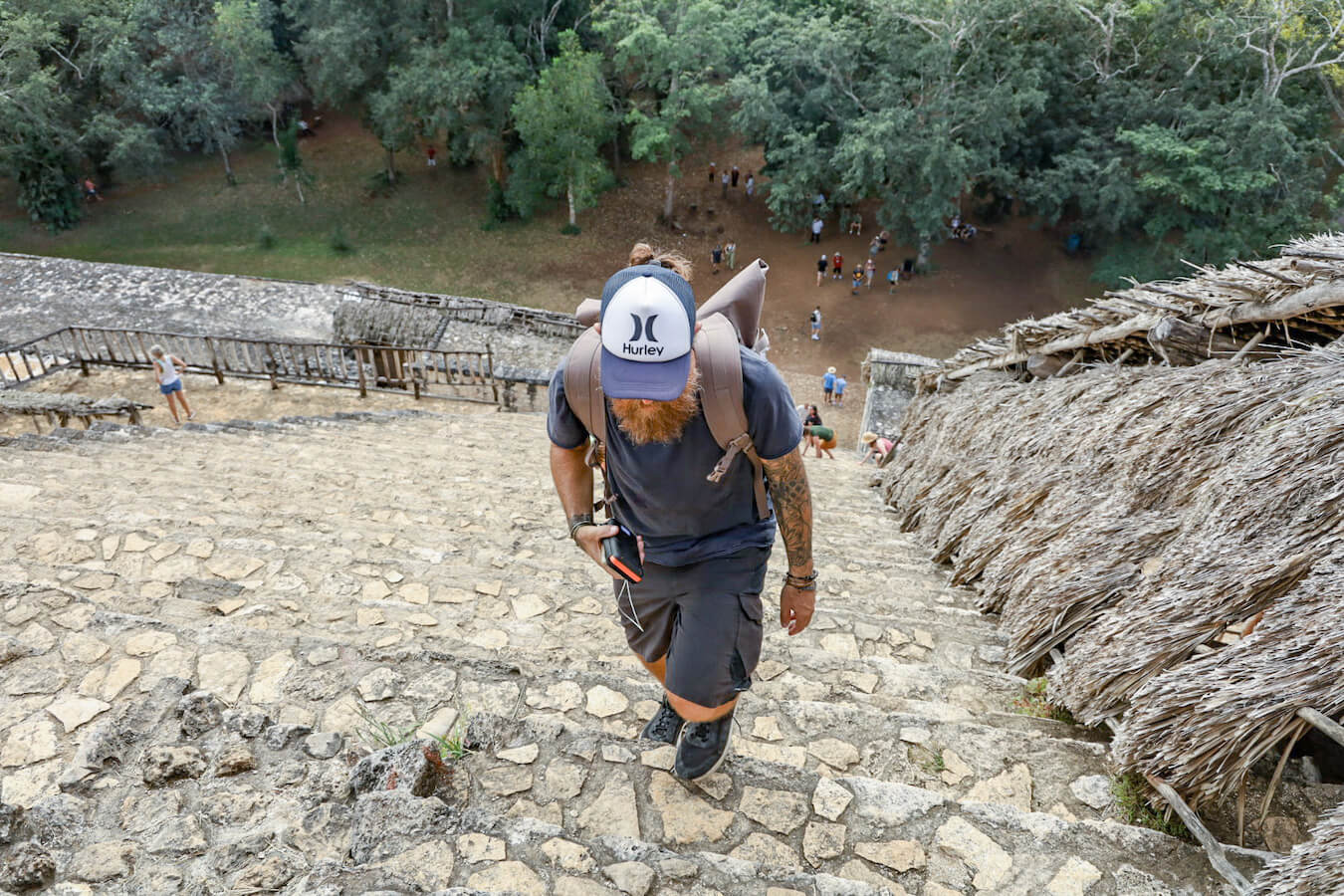 Man walks up the steps of the Mayan Archaeological Ruins of Ek' Balam near to Valladolid