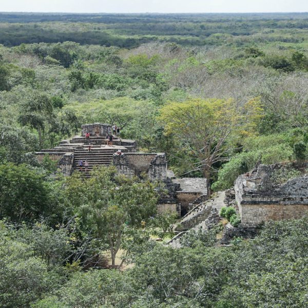 Admiring the view on a self-guided tour of Ek' Balam, while overlooking the Oval Palace and the Twins of the jungle site of Ek' Balam ruins while on self-guided tour.