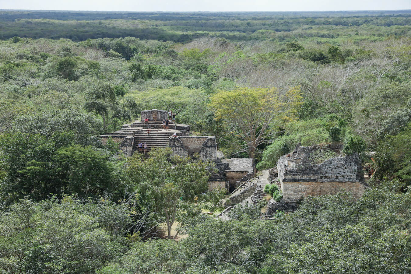 Admiring the view on a self-guided tour of Ek' Balam, while overlooking the Oval Palace and the Twins of the jungle site of Ek' Balam ruins while on self-guided tour.