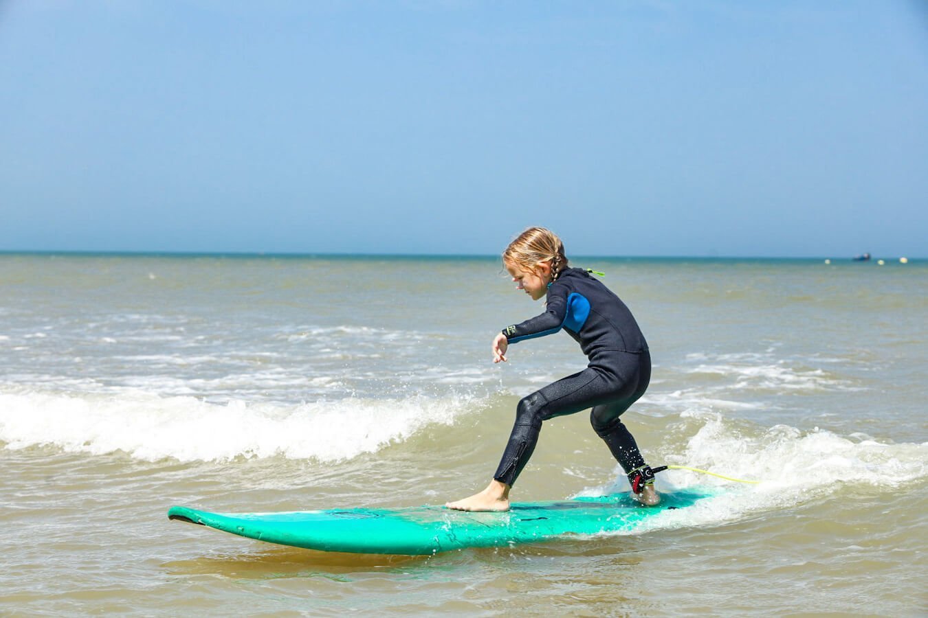 A girl learning to surf in Essaouira Morocco