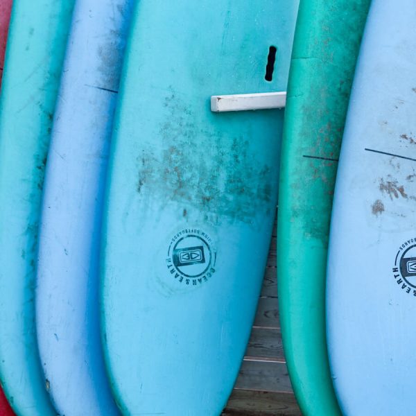 Surf boards are lined up in front of Mogasurf one of the best surf schools in Essaouira Morocco