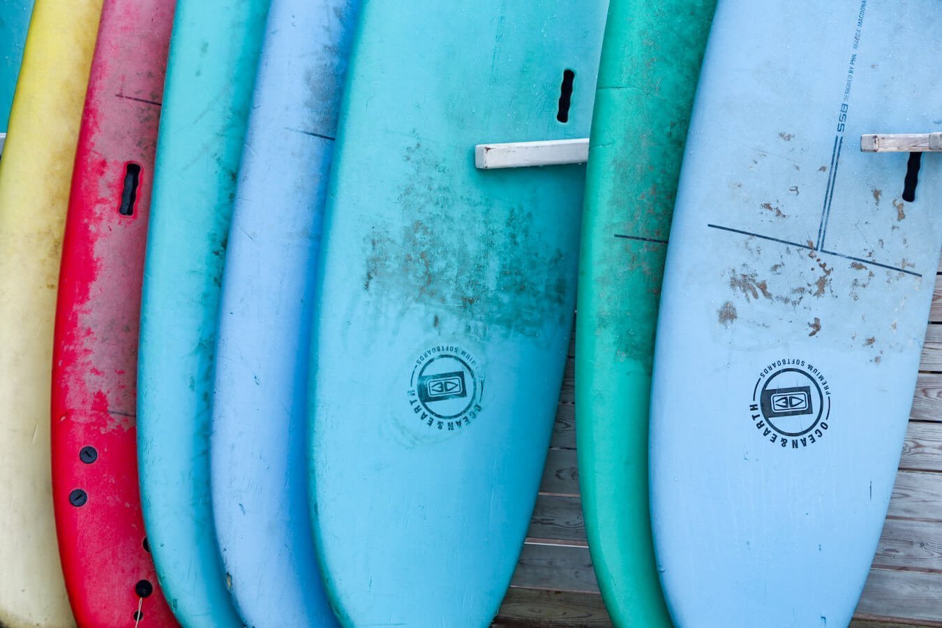 Surf boards are lined up in front of Mogasurf one of the best surf schools in Essaouira Morocco