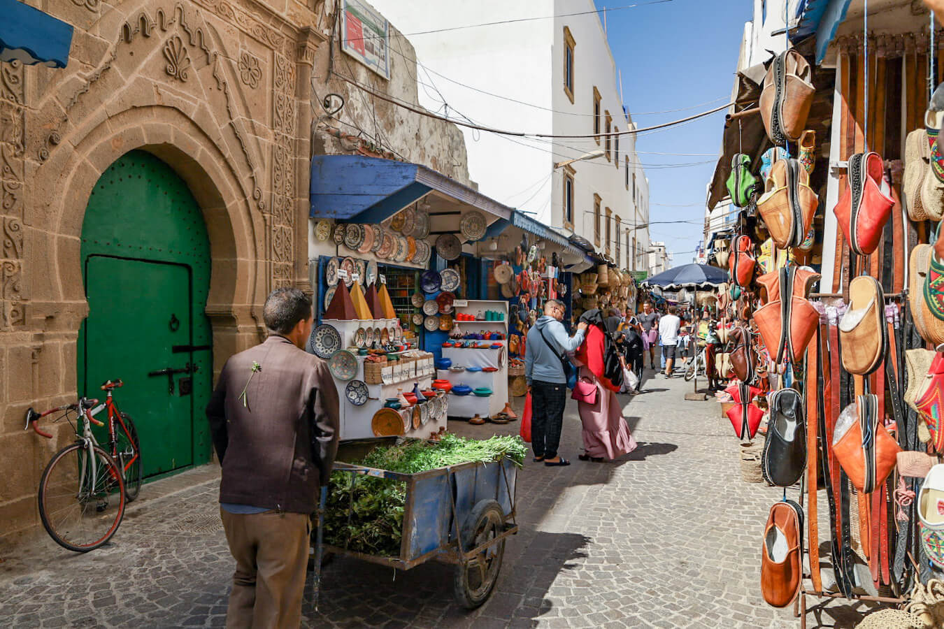 A man selling mint walks through the Medina in Essaouira