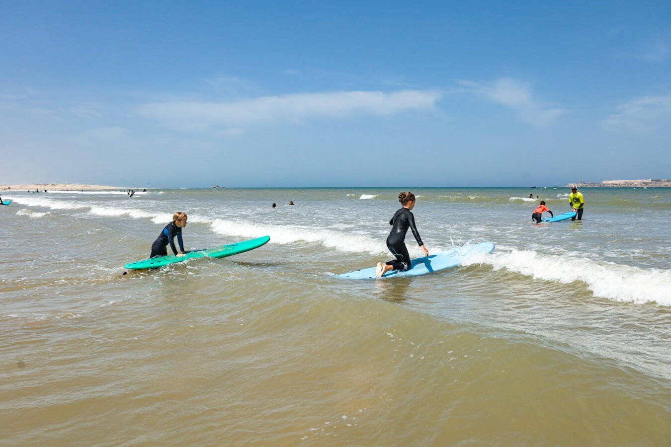 Two kids take a surf lesson in Morocco