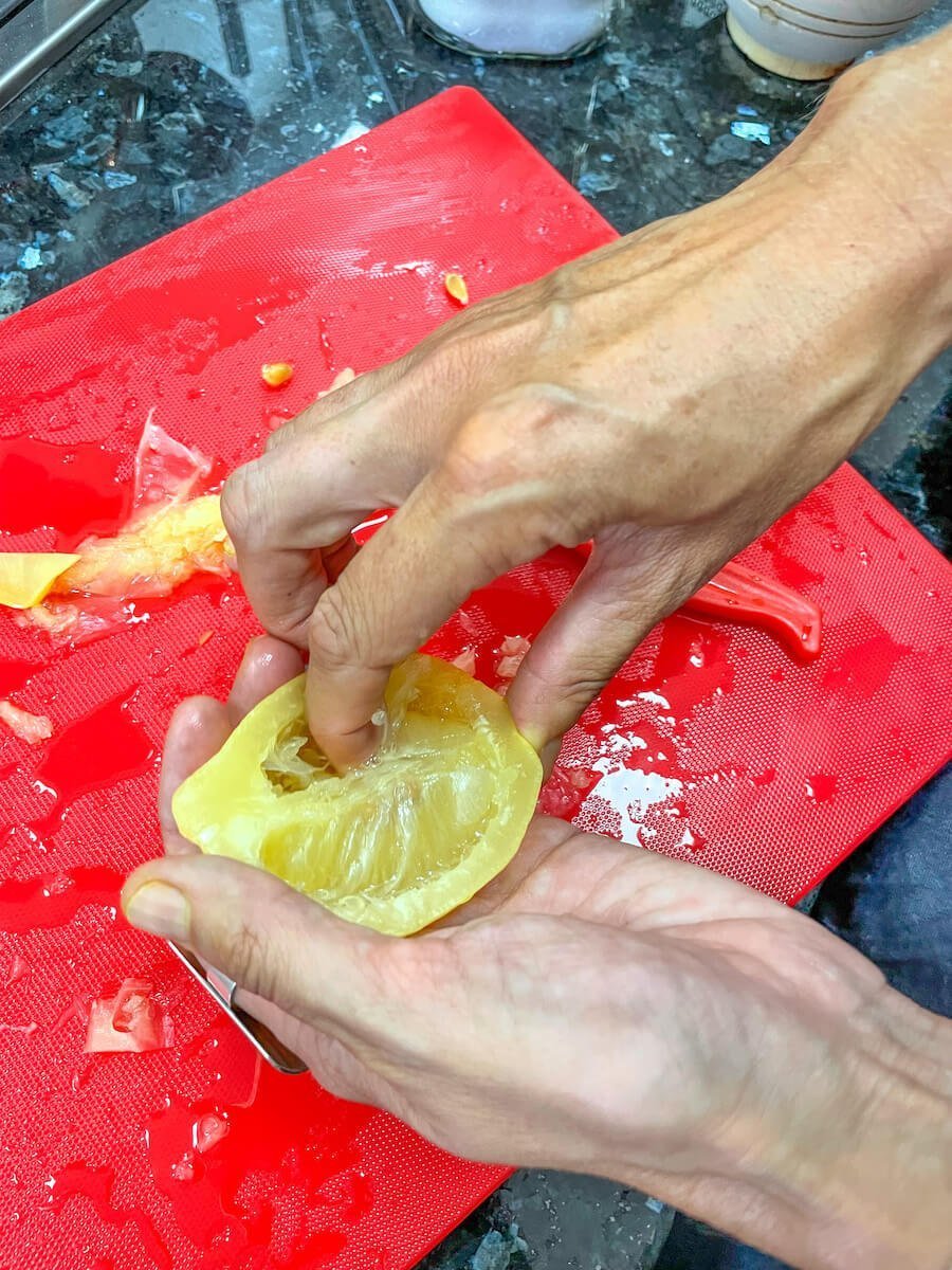 A preserving lemon is prepared for a chicken tagine in Morocco