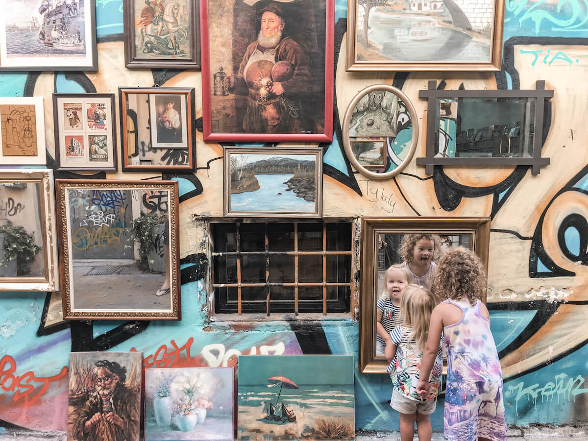 Kids having fun with a mirrored wall in Athens Greece