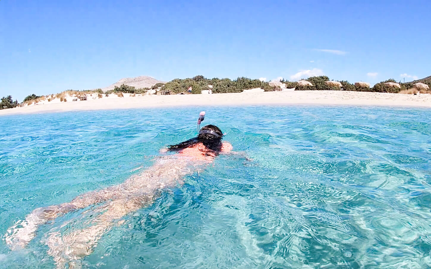 Child swims at Simos beach in Elafonisos Island in the Peloponnese region