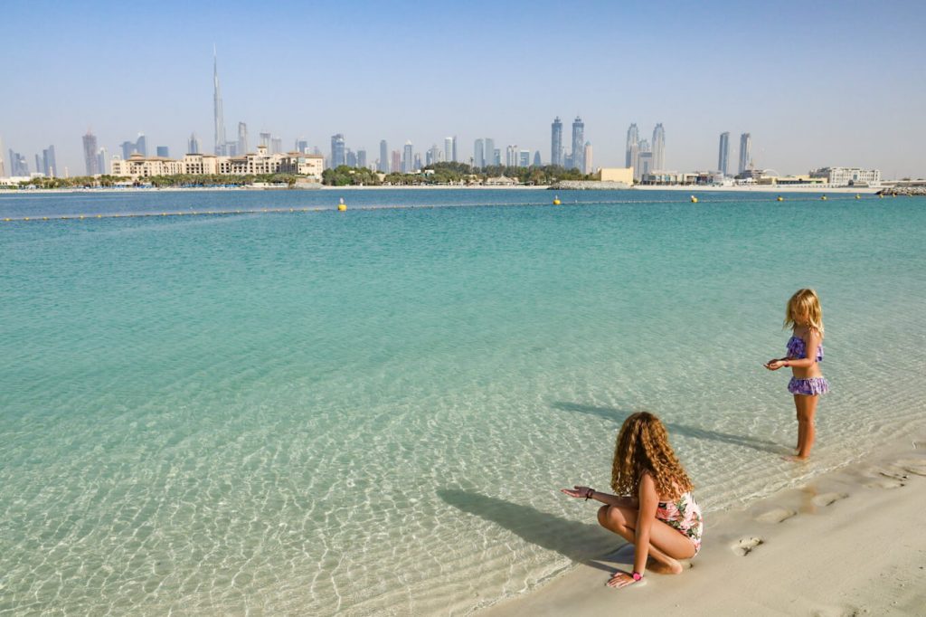 Children play at one of the most beautiful beaches in Dubai, the beach is just one of the best places to visit in Dubai
